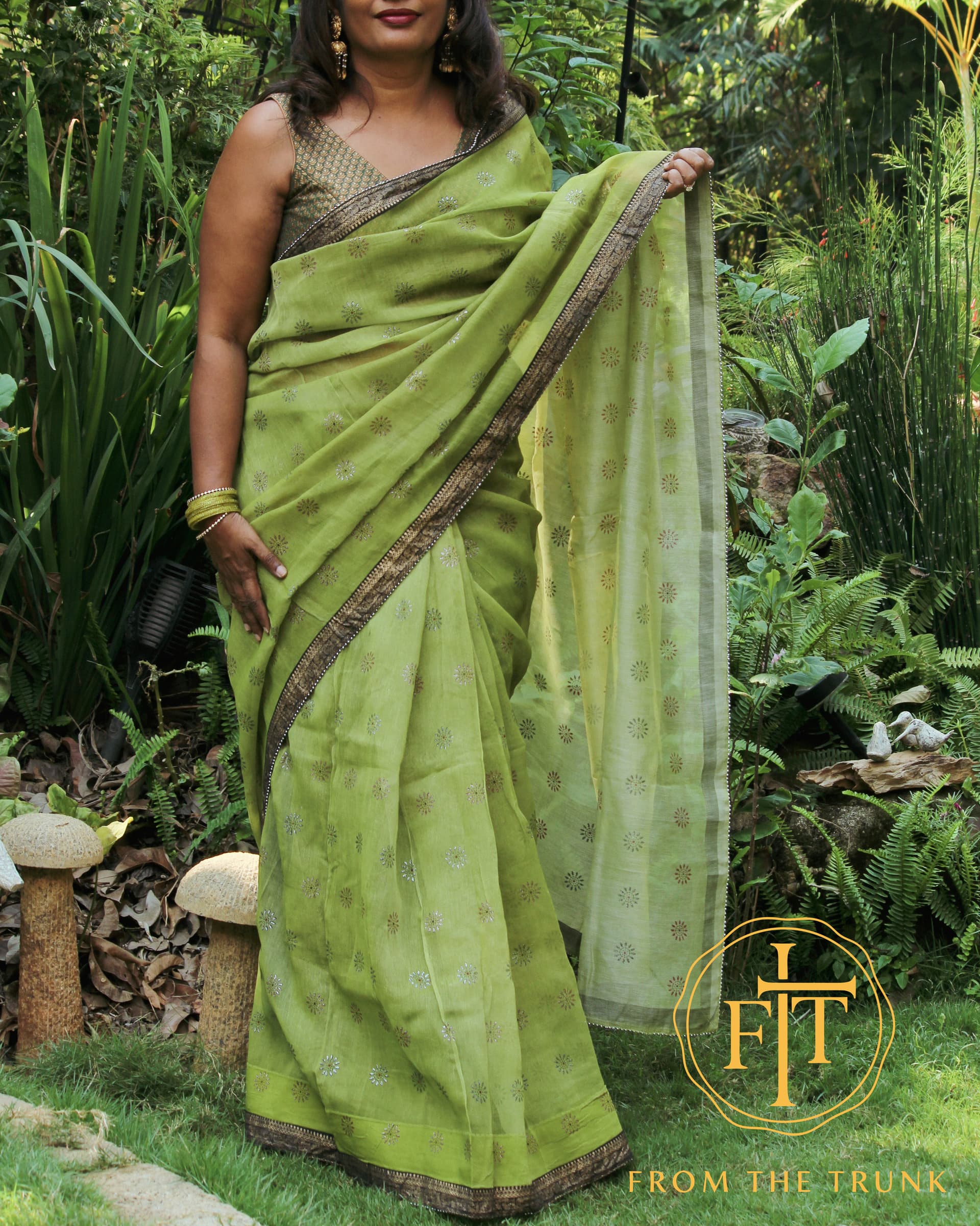 Forest green silk black gold shown as a pre-loved saree, Silk