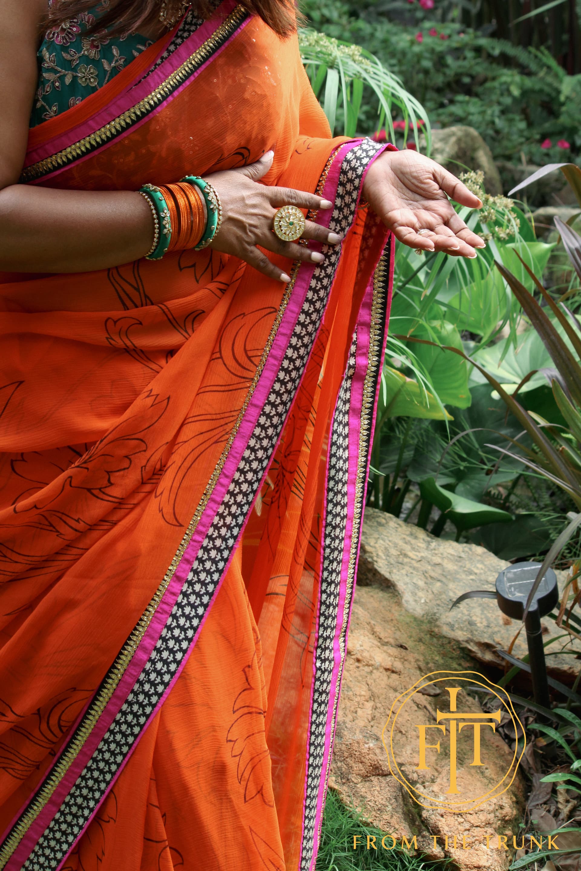 Tangerine Noir Floral Border Weave shown as a pre-loved saree, Chiffon